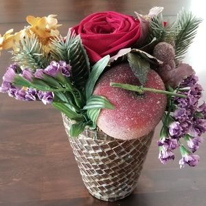 Floral arrangement in mosaic pot